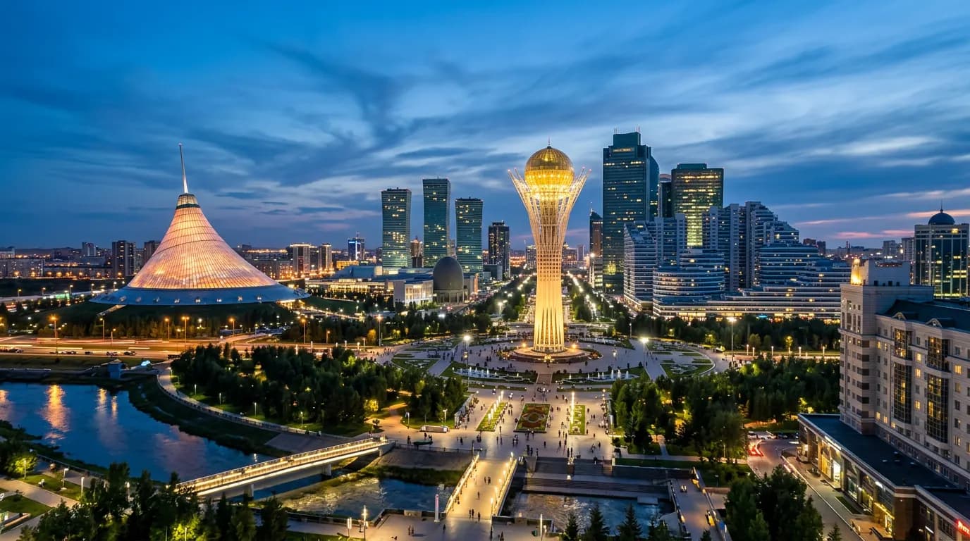 Astana skyline at dusk with the Khan Shatyr tent-shaped building and Bayterek tower